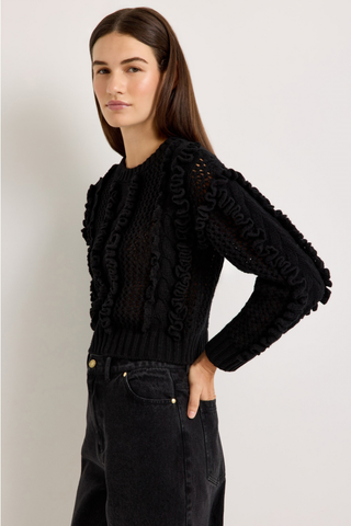 Marie Oliver Lindsay Sweater in Black featuring open-knit detailing, sculptural ruffles, and a classic crew neckline.
