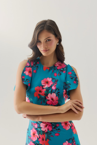 Hutch Rosalee Dress in Emerald/Pink featuring a vibrant emerald green background, bold pink floral print, high neckline, short sleeves, and flowing maxi silhouette.