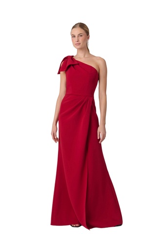 Shoshanna Killian Dress in Ruby featuring a one-shoulder neckline, statement bow, draped bodice, and full-length skirt with front slit.