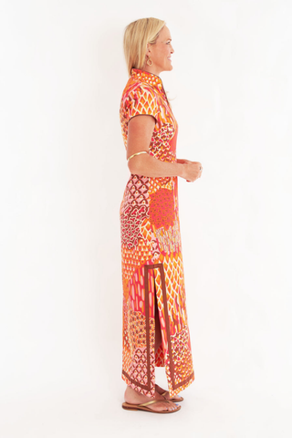 C.K. Bradley Tarpon Dress in Popplet Autumn orange and pink print with short sleeves and a flowing maxi silhouette.