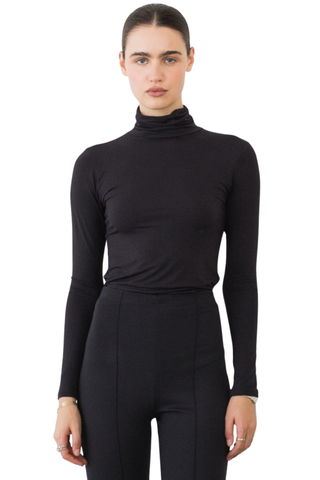 Ripley Rader Modal Turtleneck in Black featuring a fitted body-skimming silhouette, high neckline, and extra-long sleeves.