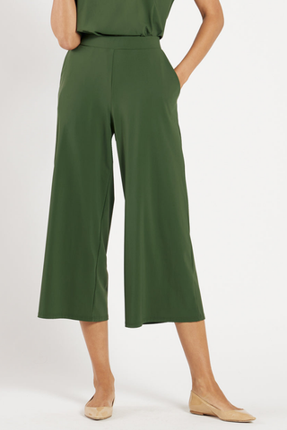 Model wearing the Jude Connally Lolly Pants in Loden with a cropped wide-leg silhouette.