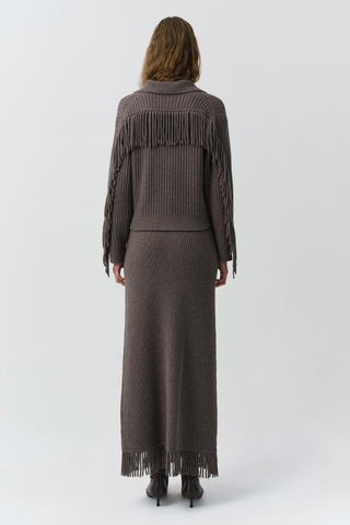 SIMKHAI Casey Midi Skirt in mushroom brown knit with a faux-wrap silhouette and fringe trim along the edge and hem.