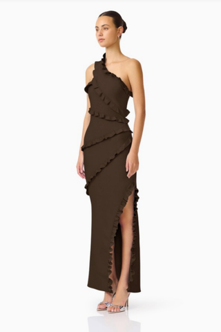 Elliatt Floriana Asymmetric Neck Gown in Brown with one-shoulder neckline, cascading ruffle detailing, floor-length skirt, and thigh-high side slit.