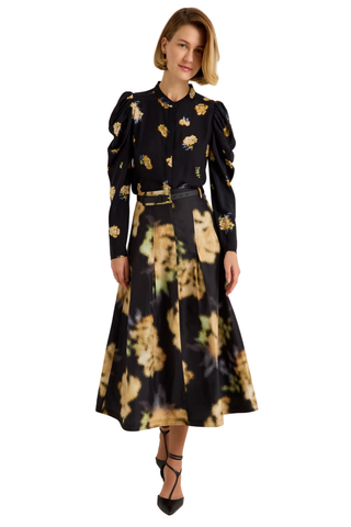 Marie Oliver Faith Skirt in Lush featuring a black and yellow abstract floral print, feminine box pleats, and flowing midi silhouette.