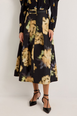 Marie Oliver Faith Skirt in Lush featuring a black and yellow abstract floral print, feminine box pleats, and flowing midi silhouette.