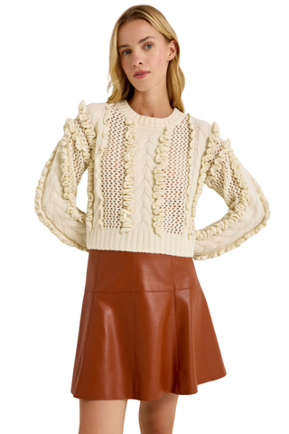 Lindsay Sweater in Ivory featuring a crew neckline, long sleeves, open knit texture, and dimensional ruffle detailing.