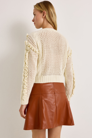 Lindsay Sweater in Ivory featuring a crew neckline, long sleeves, open knit texture, and dimensional ruffle detailing.