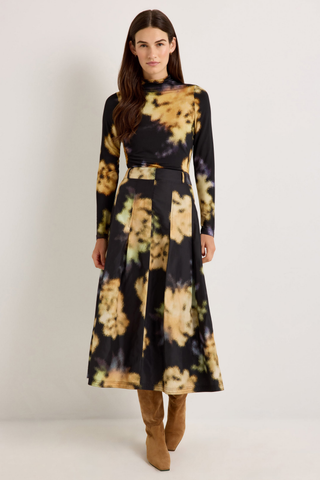 Marie Oliver Faith Skirt in Lush featuring a black and yellow abstract floral print, feminine box pleats, and flowing midi silhouette.