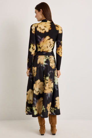 Marie Oliver Faith Skirt in Lush featuring a black and yellow abstract floral print, feminine box pleats, and flowing midi silhouette.