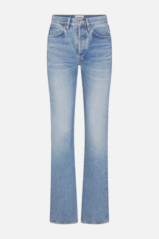 Model wearing FRAME The Vertical Jean in Static, a high-rise straight-leg rigid denim jean in a light vintage wash
