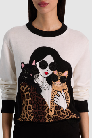 Alice + Olivia Gleeson Staceface Leopard Pullover in soft white with black trim, embellished Staceface graphic, and leopard print details.
