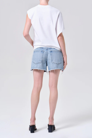 AGOLDE Nye Short in Post medium wash denim featuring a relaxed fit and longer inseam with a clean hem