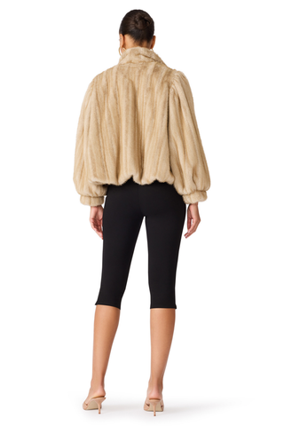 Deedee Jacket in Heather Almond featuring plush faux fur, a stand collar, voluminous sleeves, and a cropped silhouette.
