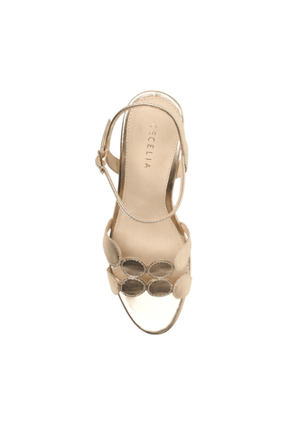 Cecelia New York Peter Heel in soft gold metallic leather with a sculptural fluted block heel, ankle strap, and rounded open toe.