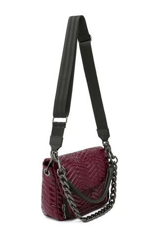 Think Royln Muse Moto Handbag in glossy deep burgundy with quilted chevron detailing and black trim.