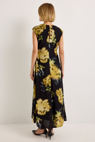 Marie Oliver Zuri Dress in Lush featuring oversized golden florals on a black background with a fluid sleeveless maxi silhouette.