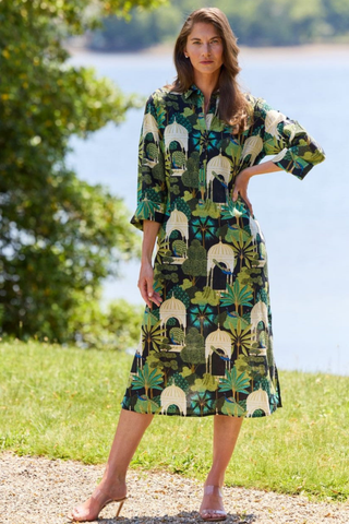 Model wearing the Jude Connally Kallan Dress in Peacock Garden Black with a relaxed midi caftan silhouette.