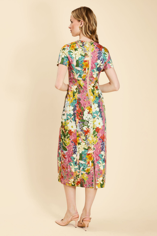 Mestiza Hampton Convertible Midi Dress in Midnight Meadows featuring a colorful floral print, short sleeves, and a column-style midi silhouette.