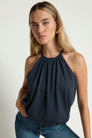 Model wearing the Nation LTD Bell Bubble Top in Night Sky featuring a gathered halter-inspired neckline, bubble hem, and relaxed Pima cotton silhouette.