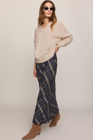 Z Supply Crestview Plaid Skirt in Eclipse featuring a dark neutral plaid pattern, bias-cut midi silhouette, and flowing hem.