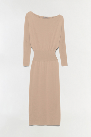 SIMKHAI Janese Off Shoulder Midi Dress in Camel featuring a wide off-the-shoulder neckline, fitted waist, and straight midi skirt.