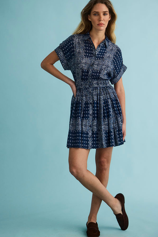 Hunter Bell Howard Dress in Inkwell Paisley featuring a blue paisley print, short sleeves, button-front bodice, and tiered mini skirt.