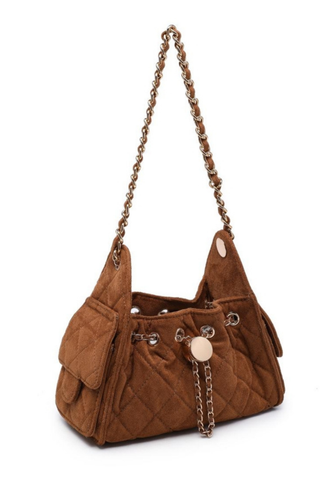 Urban Expressions Royalty Shoulder Bag in Cognac featuring quilted faux suede, gold-tone hardware, woven shoulder strap, and drawstring closure.