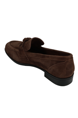 Brown suede Kaye Loafer with apron toe, knotted keeper strap, and low stacked heel.