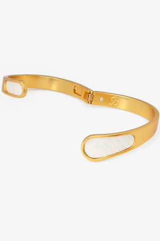 Brackish Alexis Bezel Hinge Cuff bracelet featuring white feather bezel accents and 18kt matte gold plated hardware