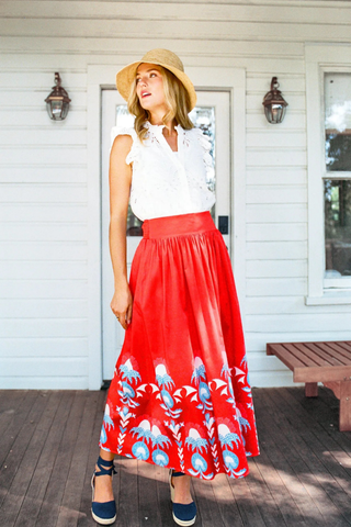 Sheridan French Lillian Skirt in Red Thistle featuring vibrant red print, maxi silhouette, smocked waistband, and colorful border detailing