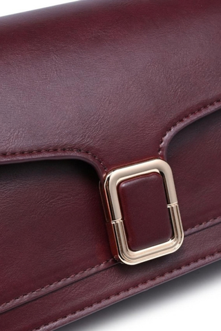 Urban Expressions Coco Crossbody in Wine featuring a structured vegan leather silhouette, flap front, buckle detail, and detachable strap.