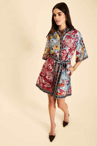 Mestiza Aracati Mini Dress in Venetian Patchwork featuring a colorful mixed print, mandarin collar, three-quarter sleeves, and self-tie waist.