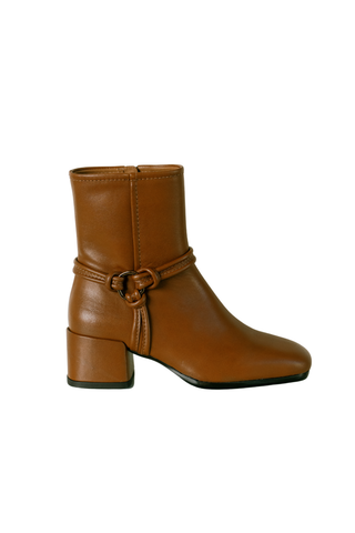 Homers Niki Bootie in Crimea Sella, a cognac brown ankle boot with buckle hardware, rounded toe, and block heel.