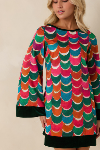 Prosperina Shannon Dress in Party Planner featuring a vibrant multicolor geometric print, long sleeves with dark green cuffs, and a relaxed mini shift silhouette.