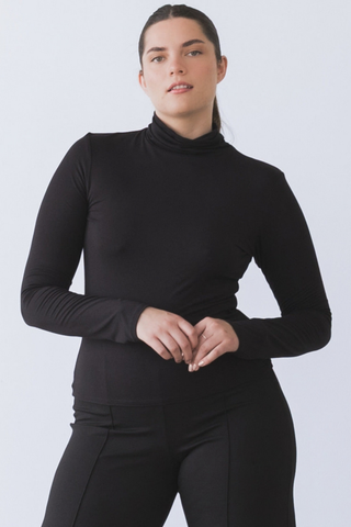 Ripley Rader Modal Turtleneck in Black featuring a fitted body-skimming silhouette, high neckline, and extra-long sleeves.