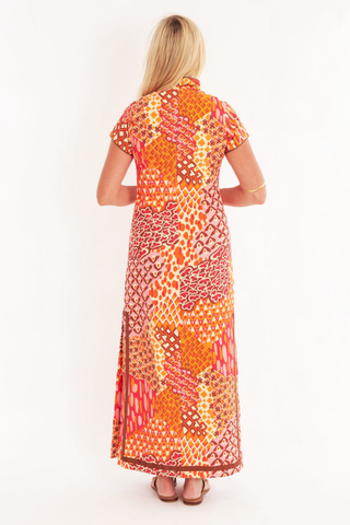 C.K. Bradley Tarpon Dress in Popplet Autumn orange and pink print with short sleeves and a flowing maxi silhouette.