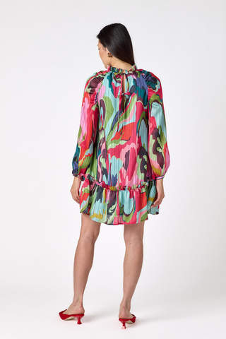 Crosby Flynn Dress in Life Of The Party featuring a vibrant multicolored abstract print, long sleeves, collared neckline, and flounced mini hem.