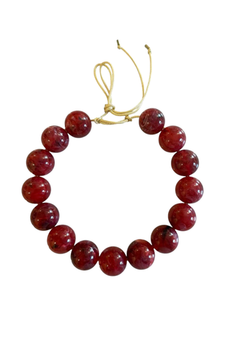 KMS Gems Chunky Beaded Necklace in Fall Berries featuring oversized glossy berry-red beads and an adjustable gold silk cord.