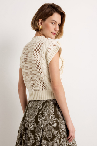 Marie Oliver Kennedy Top in Ivory featuring an open knit design, dimensional ruffle trim, crew neckline, and sleeveless cropped silhouette.