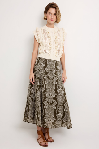 Marie Oliver Kennedy Top in Ivory featuring an open knit design, dimensional ruffle trim, crew neckline, and sleeveless cropped silhouette.