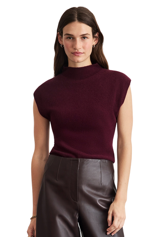Tanya Taylor Adrien Cashmere Turtleneck in Blackberry featuring a fitted sleeveless-style silhouette with cap sleeves and a refined mock neckline.
