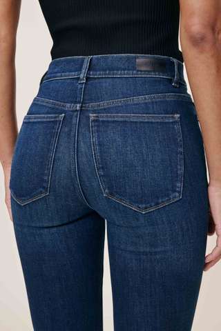 Model wearing the DL1961 Bridget Boot Jean in Sea Front with a high-rise bootcut silhouette.