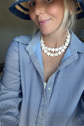 Smith & Co. Design Large Sea Star Necklace in Coconut featuring oversized cream-colored star beads and a gold-plated lobster clasp.