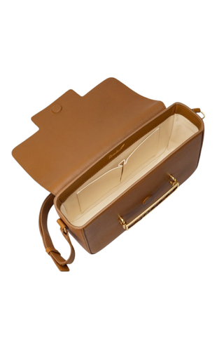 Brackish Oxford Crossbody Bag in Tan Quail with vegetable-tanned leather, layered feather hardware detail, adjustable shoulder strap, and structured crossbody silhouette