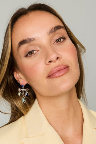 Mignonne Gavigan Riva Earrings in Multi featuring an artistic arrangement of blue, green, and neutral faceted glass gemstones in a gold-plated statement silhouette.