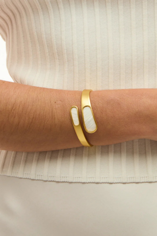 Brackish Alexis Bezel Hinge Cuff bracelet featuring white feather bezel accents and 18kt matte gold plated hardware
