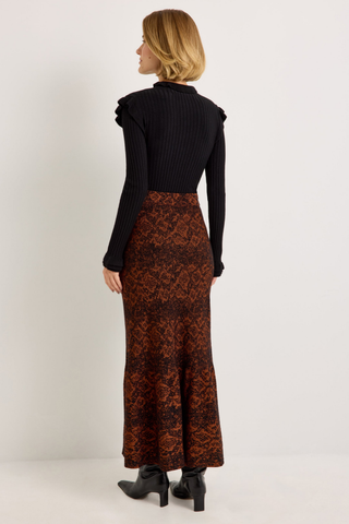 Shiloh Skirt in Oxide featuring a rust and black abstract print, fitted silhouette, and softly flared mermaid hem.
