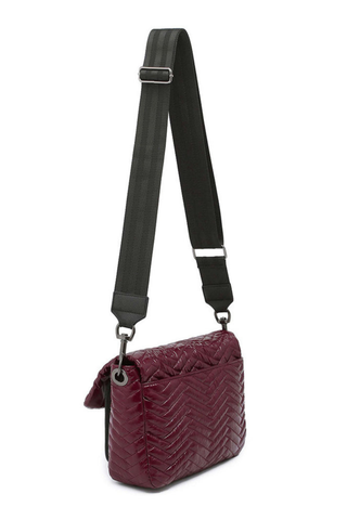 Think Royln Muse Moto Handbag in glossy deep burgundy with quilted chevron detailing and black trim.