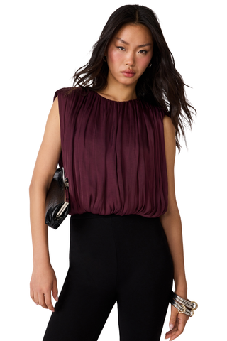 Steve Madden Milana Top in Purple Wine, a sleeveless burgundy blouse with gathered detailing and a relaxed silhouette.